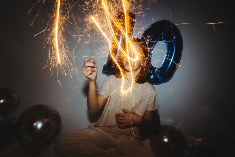 A vibrant 10th birthday party with sparklers and blue balloons creating a magical atmosphere.