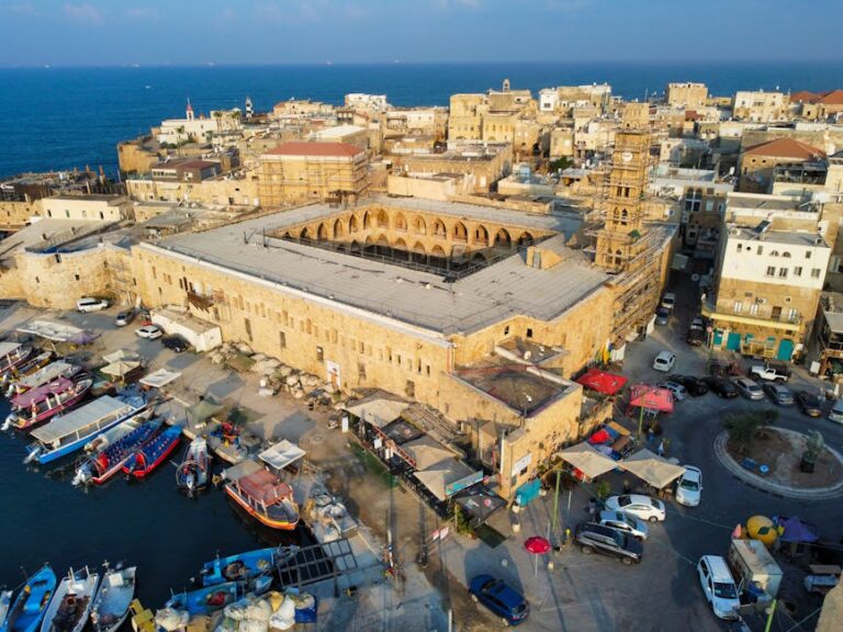 Stunning aerial shot of Acre harbor showcasing historic architecture and vibrant boats.