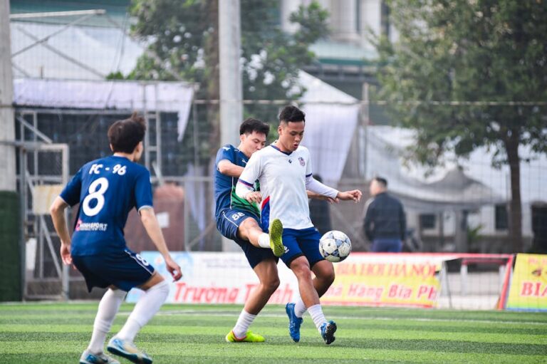 Action-packed football game at a local field in Hà Nội, showcasing teamwork and competition.