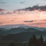 Tranquil view of Brixen im Thale mountains at sunset, capturing serene natural beauty.