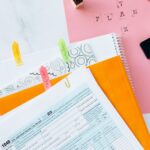 Overhead view of tax documents, forms, and organized work area for tax preparation.