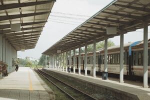A deserted rural train station with a vintage nostalgic atmosphere and overcast sky.